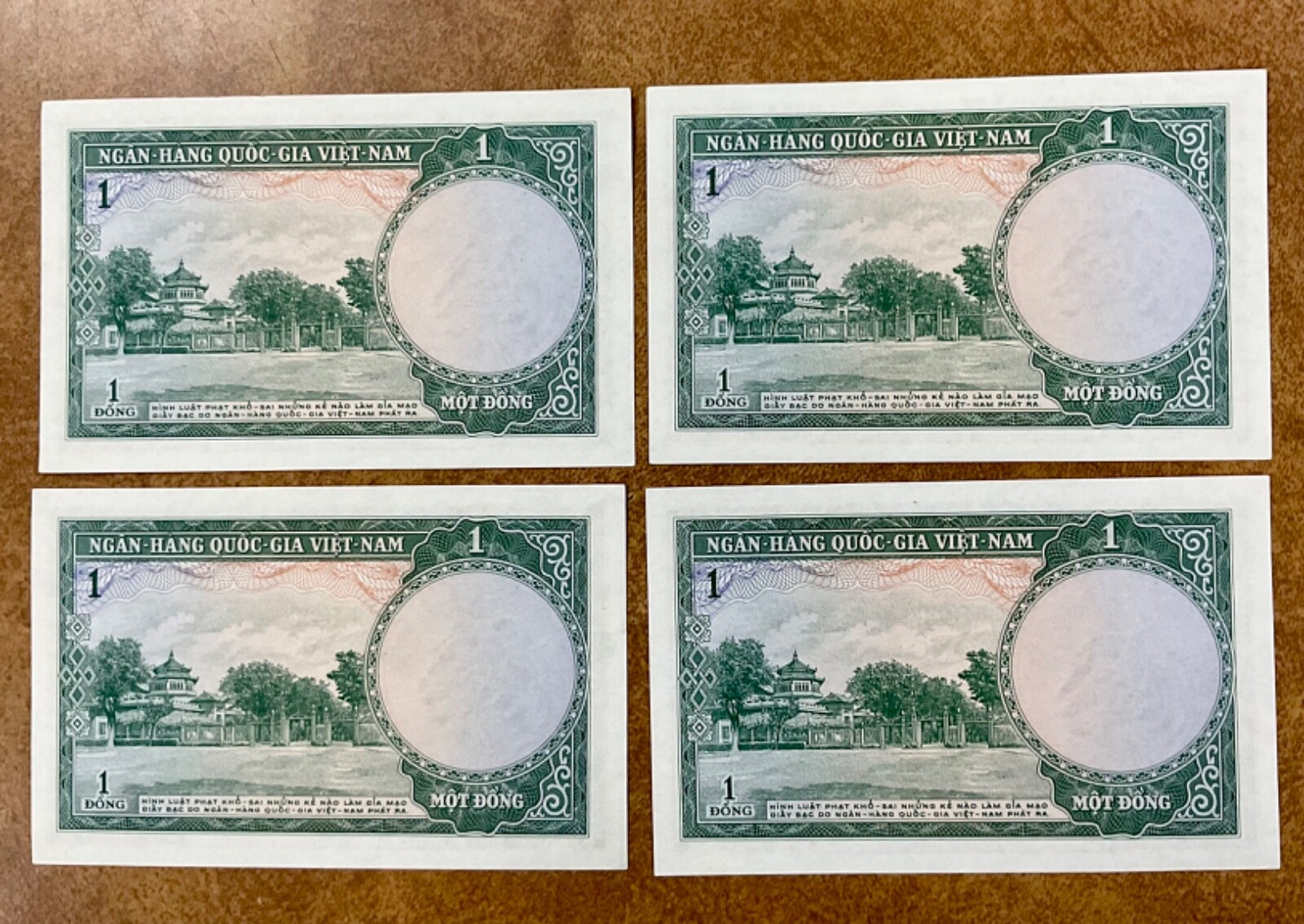 1956 Vietnam P1, 1 Dong, temple & gardens 4 consecutive serial #s.